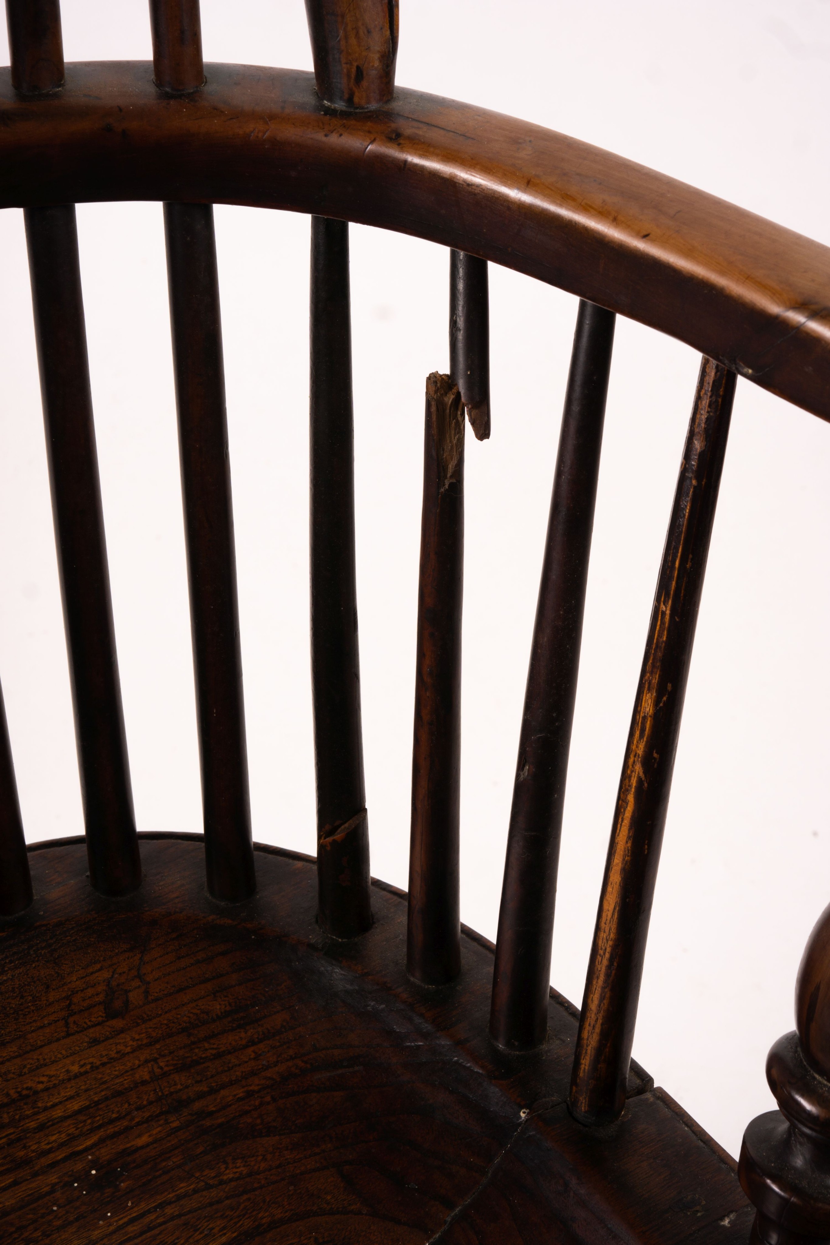 A mid 19th century yew and elm Yorkshire area Windsor armchair with saddle-seat and crinoline stretcher, width 63cm, depth 47cm, height 110cm